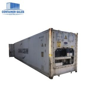 White CMA CGM refrigerated shipping container, weathered with rust along the edges, shown on a white background.