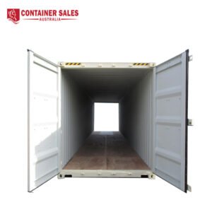 Open shipping container with double doors wide, showing an empty wooden floor and corrugated metal walls; 'Container Sales Australia' logo in the top-left.