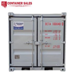 Grey double-doors shipping container with red identification text 'BETA 100040' and weight data on the right door; Container Sales Australia logo in the top-left corner.