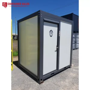 Grey double-door portable toilet container with a restroom symbol on the door; Container Sales Australia logo is in the top-left corner.